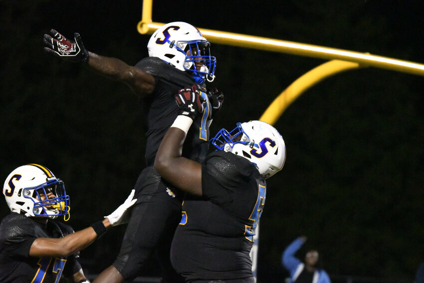 Sumter High's Reggie Shannon (1) is lifted in the air by offensive lineman Javon Canty as they celebrate a touchdown against Gray Collegiate on Friday.