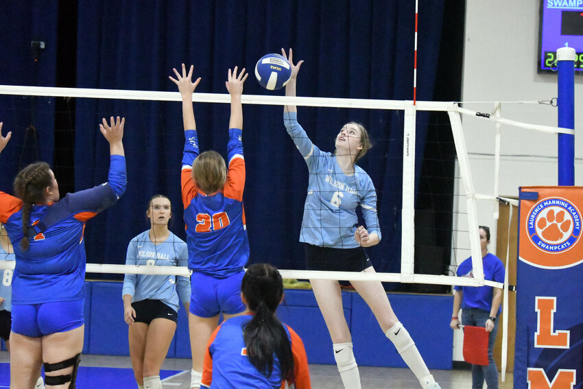 Wilson Hall's Beaty Zeigler (6) goes up for a kill against Laurence Manning on Tuesday.