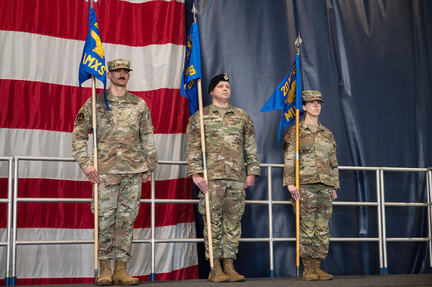 From left, U.S. Air Force Master Sgt. Peter Simonelli, 20th Aircraft Maintenance Squadron first sergeant, Senior Master Sgt. Craig Oas, 20th Maintenance Squadron first sergeant, and Senior Master Sgt. Stephanie Jones, 20th Munitions Squadron first sergeant, stand with their respective guidons during the 20th Maintenance Group reorganization ceremony at Shaw Air Force Base on Oct. 9. The reorganization ceremony signified the realignment of the