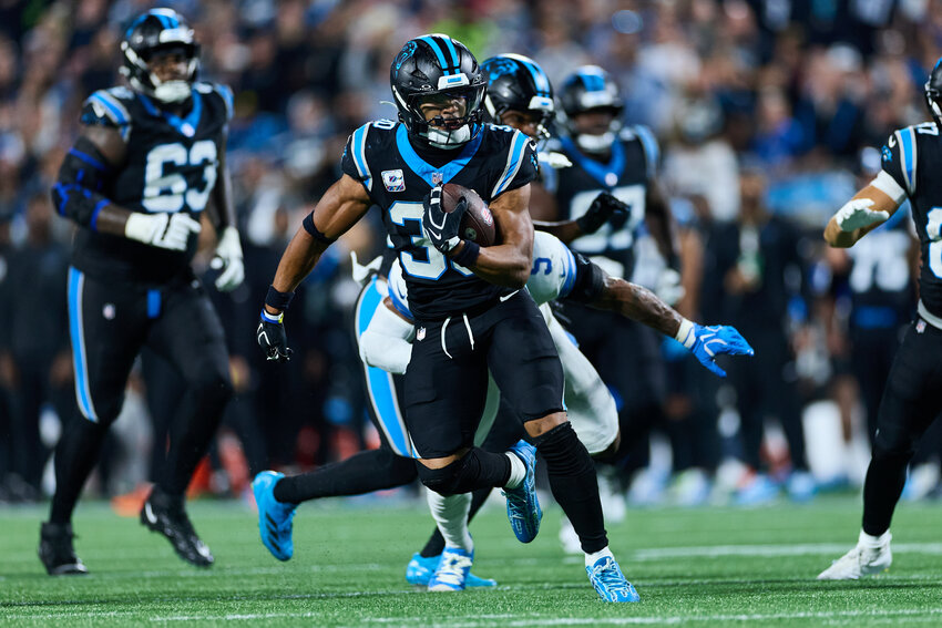Carolina Panthers running back Chuba Hubbard (30) runs the ball against the Detroit Lions in Charlotte on Sunday, Oct. 4, 2026.