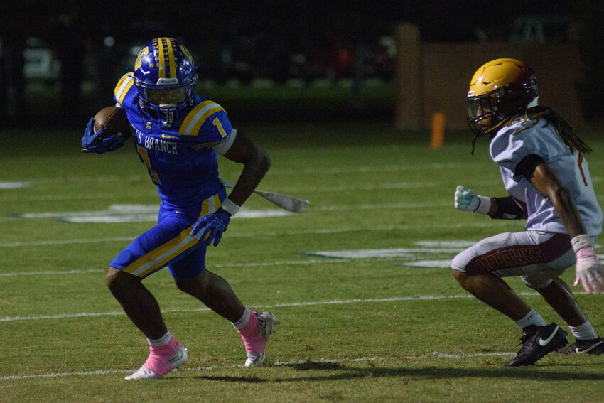 Scott's Branch senior Keith Rogers (1) carries the ball against Bethune-Bowman on Friday.