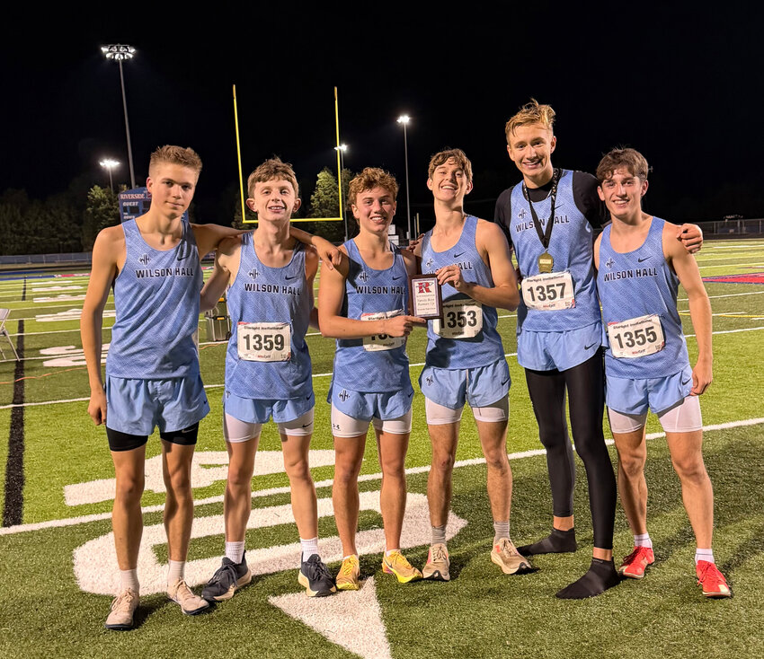The Wilson Hall cross country team poses after finishing second at the Starlight Invitational on Saturday.