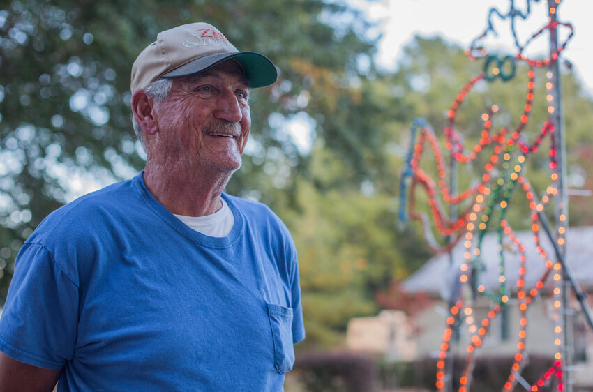 Charlie Dubose decorates Gaddy Court for the Seasons Greetings Christmas Light Show on Oct. 26, 2022.