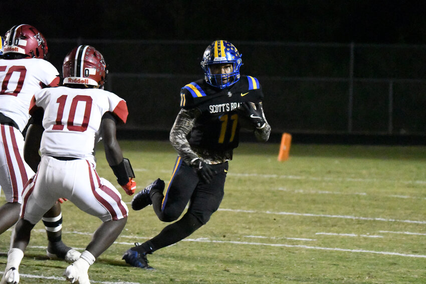 Scott's Branch senior Quintin Jackson (11) carries the ball against Bamberg-Ehrhardt on Friday.