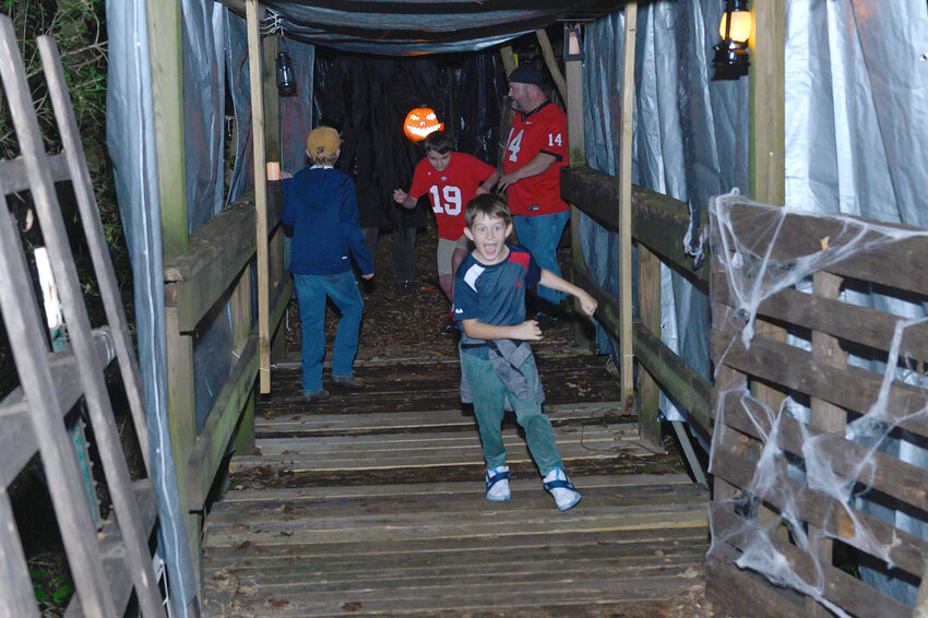 A child screams along the Terror Trail in Sumter last October. The mile-long trail, at 1104 Old W. Liberty St., is organized and operated by Sumter Elks Lodge #855 to support the lodge and its educational grants. The frighteningly fun attraction will run every Friday and Saturday night, starting at 7:30 p.m., ending on the night of Halloween, Oct. 31. Tickets cost $19 per person.