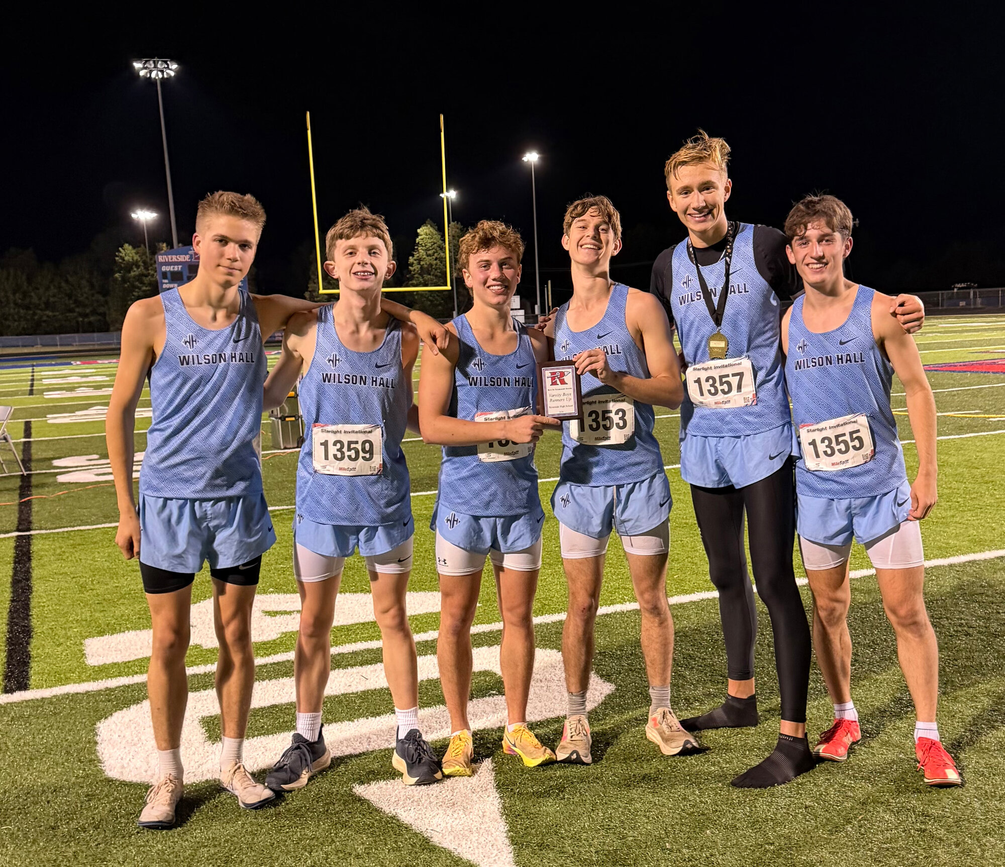 The Wilson Hall cross country team poses after finishing second at the Starlight Invitational on Saturday.